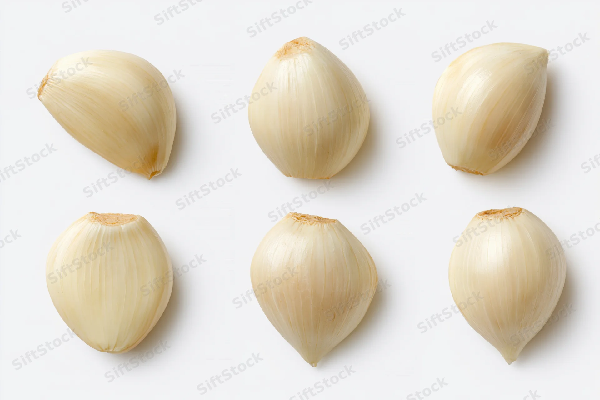 Six peeled garlic cloves arranged in two rows on a white background