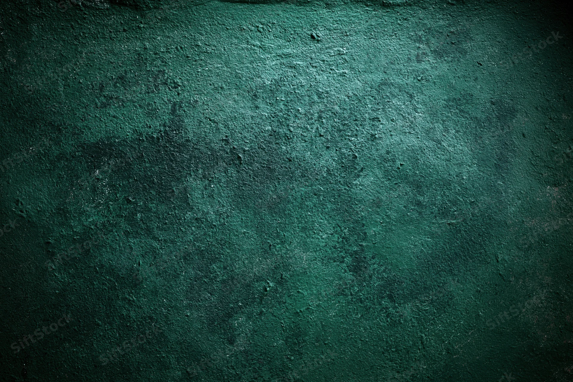 Textured green surface filling the frame as a backdrop