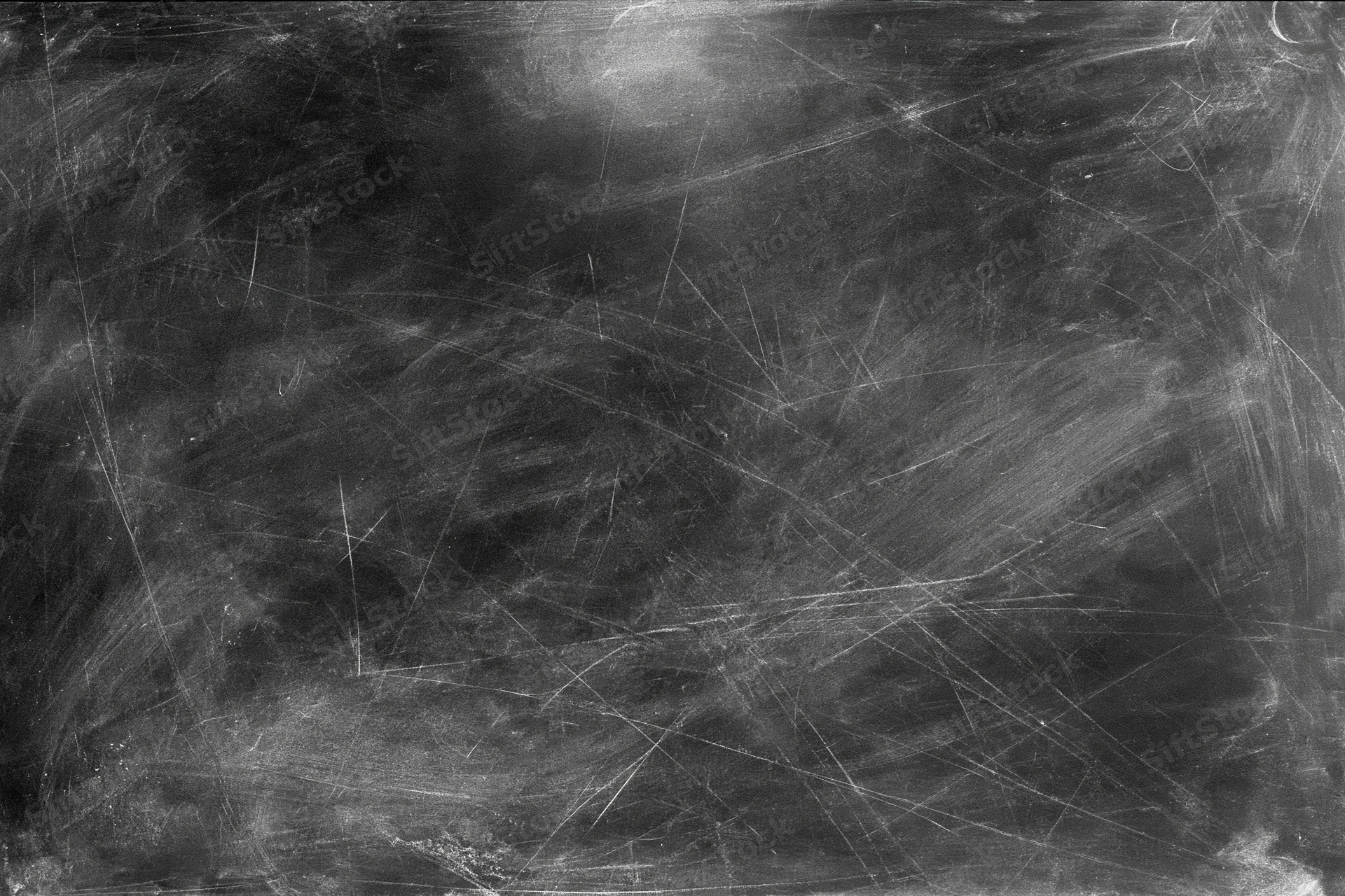 Aged black chalkboard surface covered in fine scratches and dust