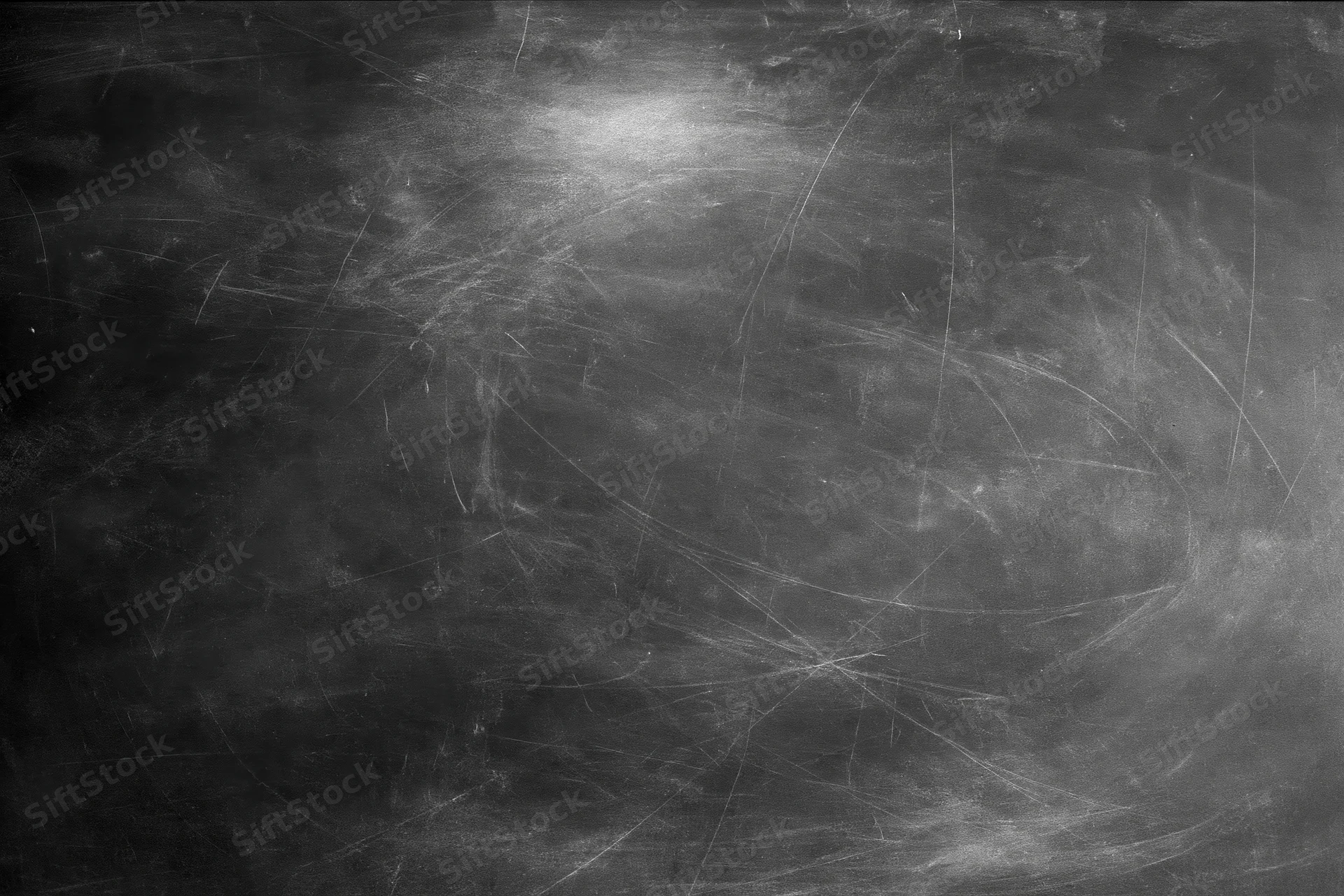 Aged black chalkboard surface covered in fine scratches and dust residue