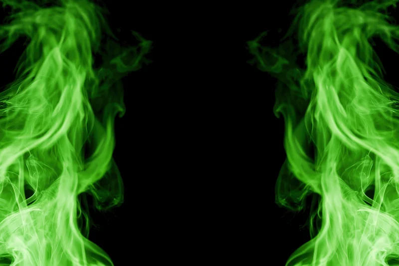 Neon green smoke wisps rising from both lower corners against black background