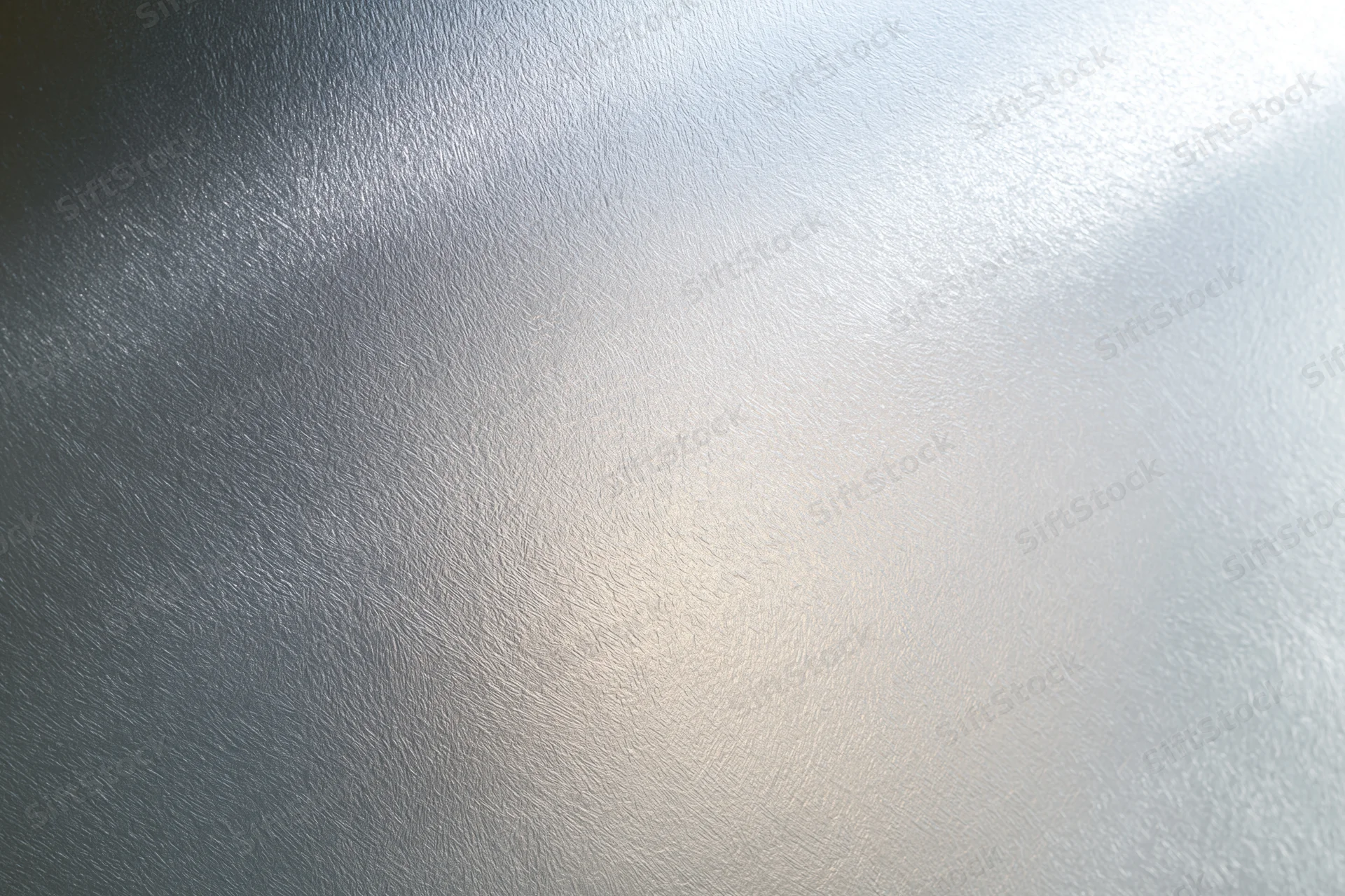 Close-up of frosted glass surface with soft light gradient and subtle texture