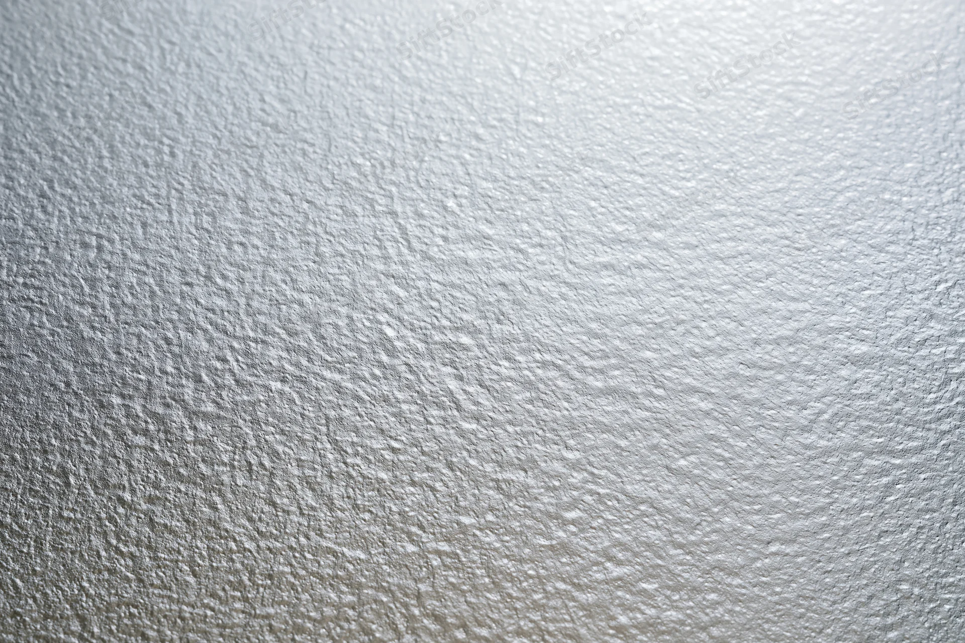 Close-up flat lay of a frosted glass surface with fine textured pattern
