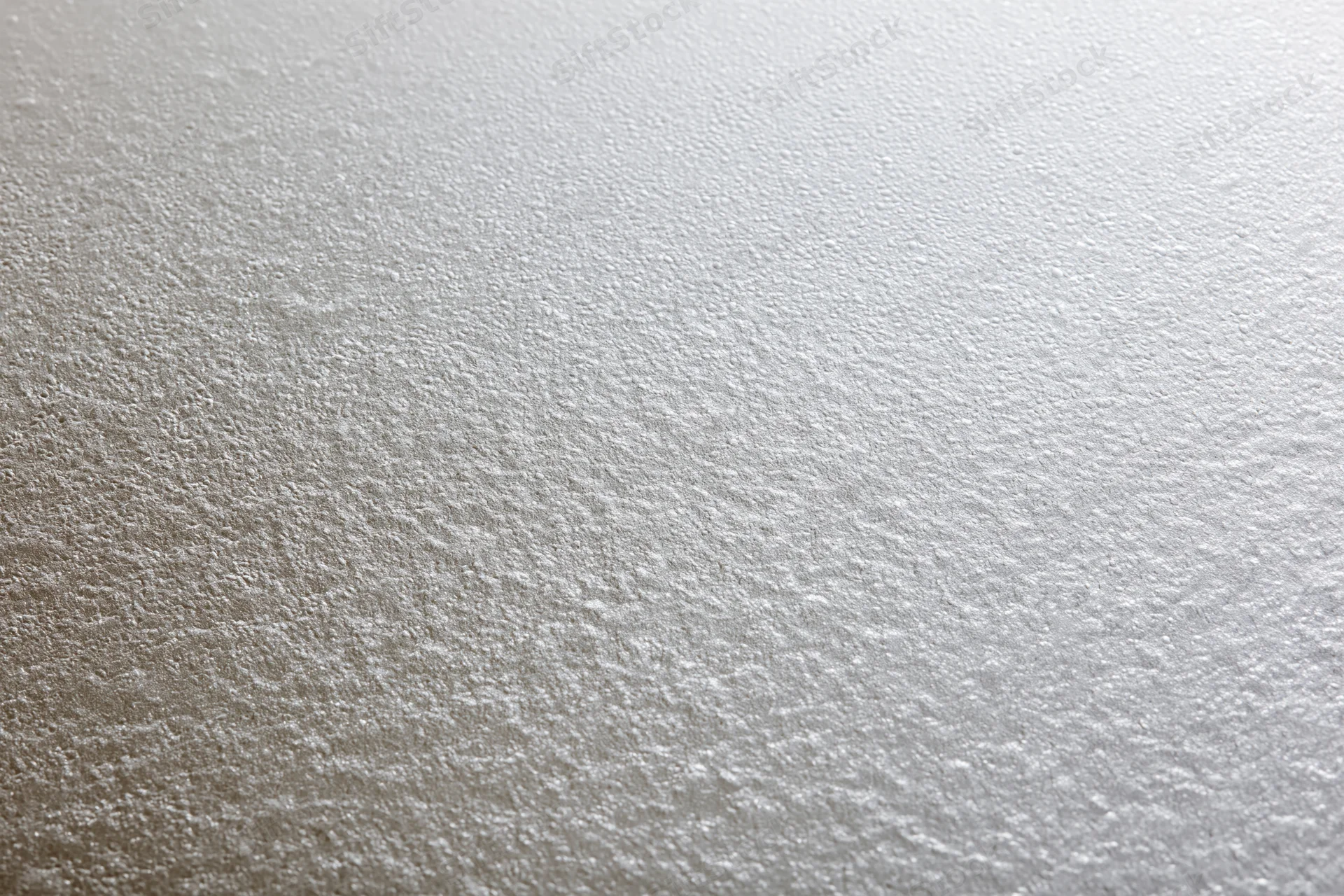 Close-up flat lay of a frosted glass surface with fine textured pattern
