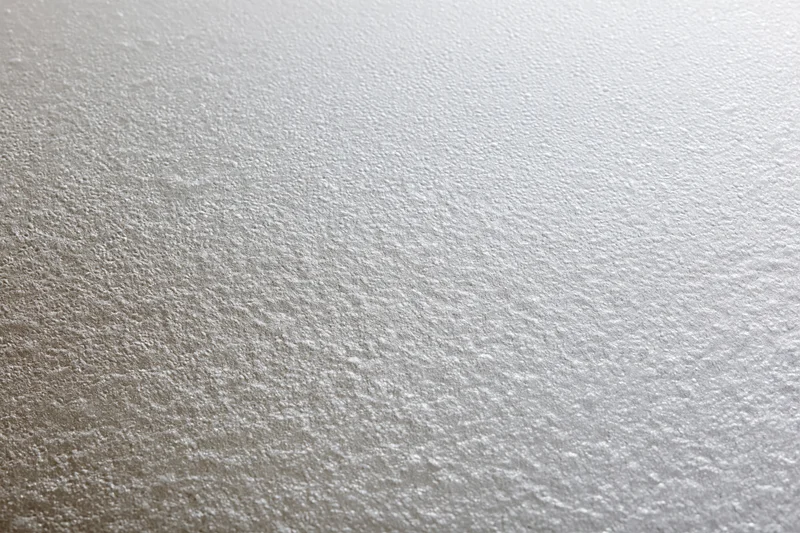 Close-up flat lay of a frosted glass surface with fine textured pattern