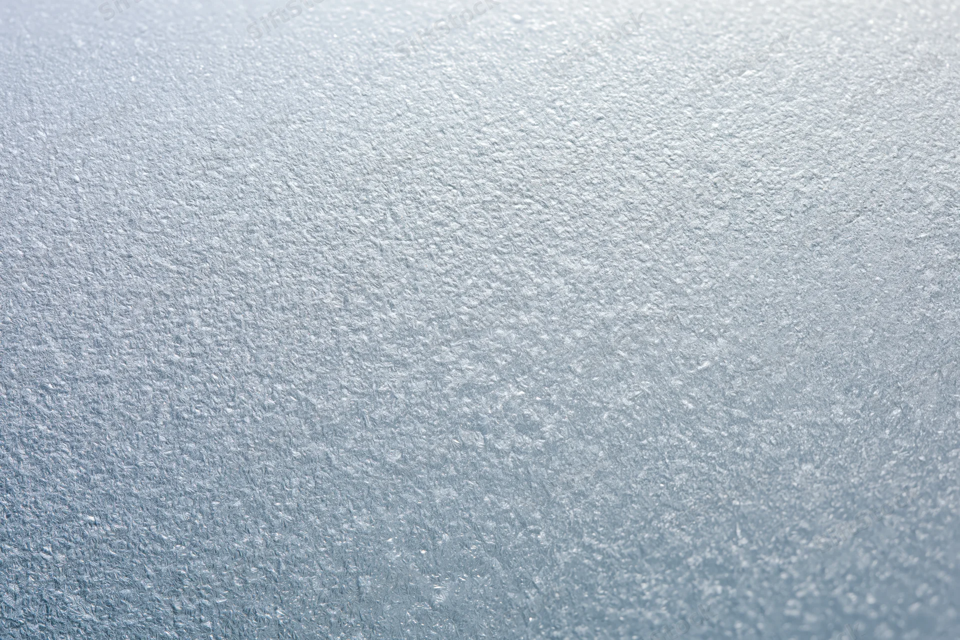 Frosted glass surface with crystalline texture in flat lay arrangement