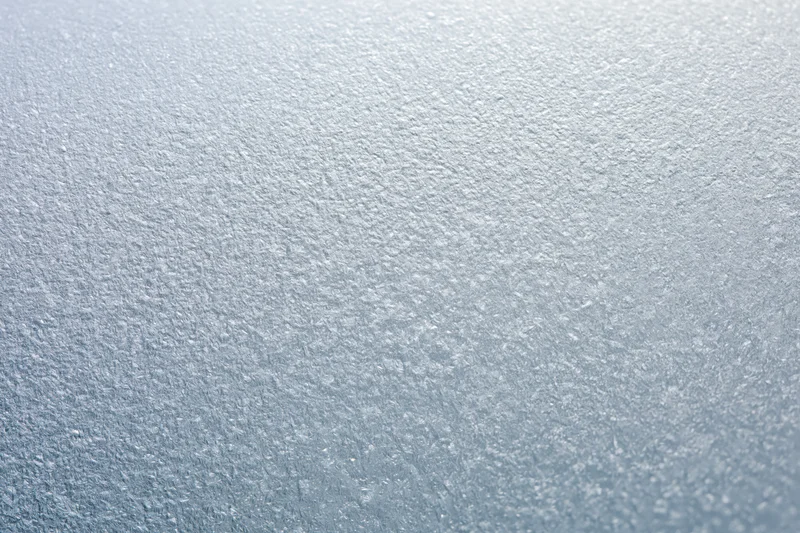 Frosted glass surface with crystalline texture in flat lay arrangement