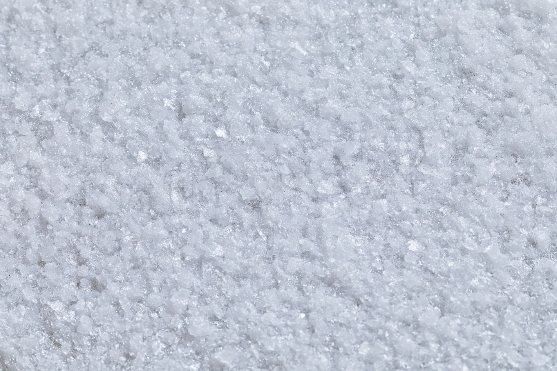 Close-up flat lay of a frosted white metal surface with textured grain pattern