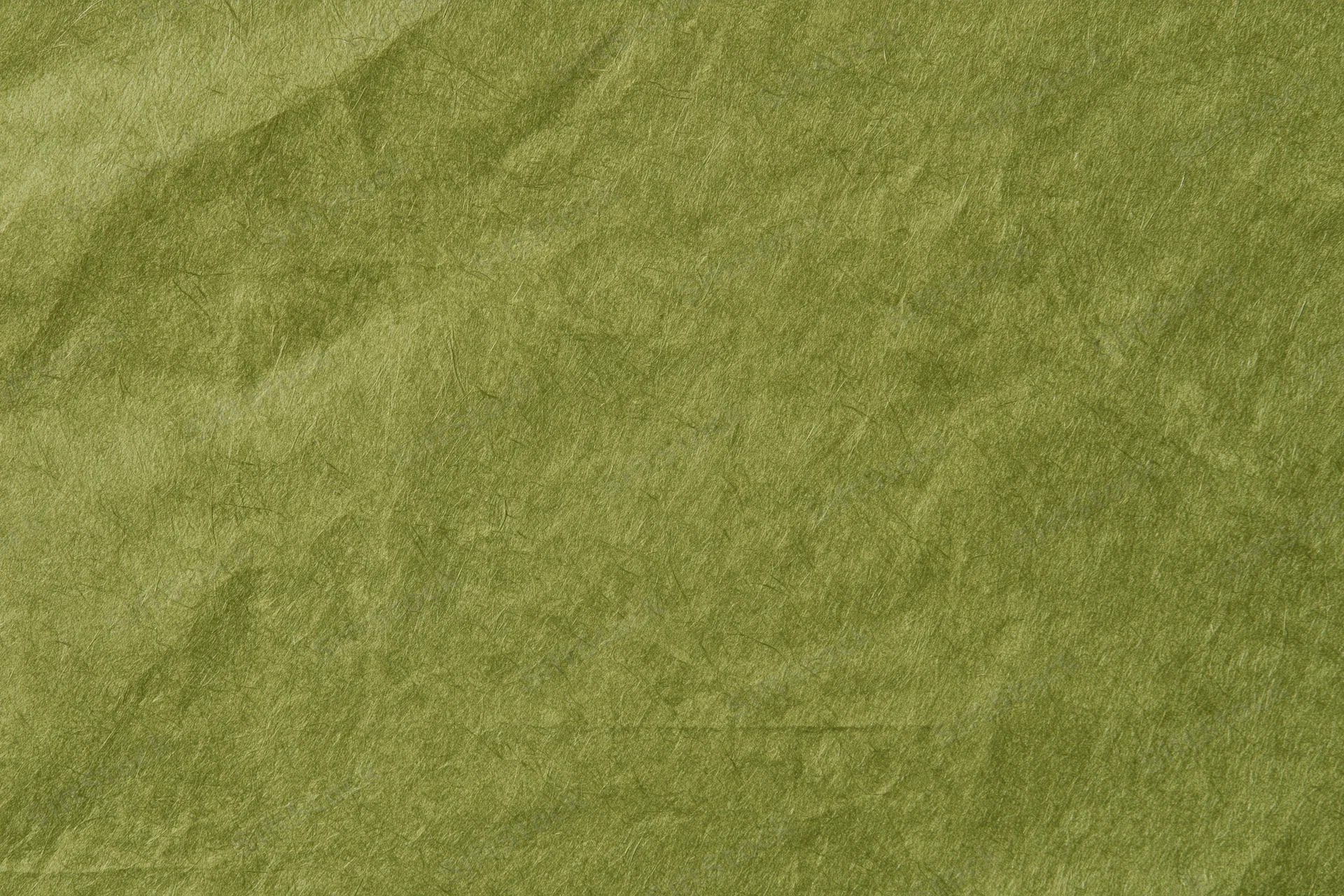 Close-up flat lay of plain olive green fabric surface