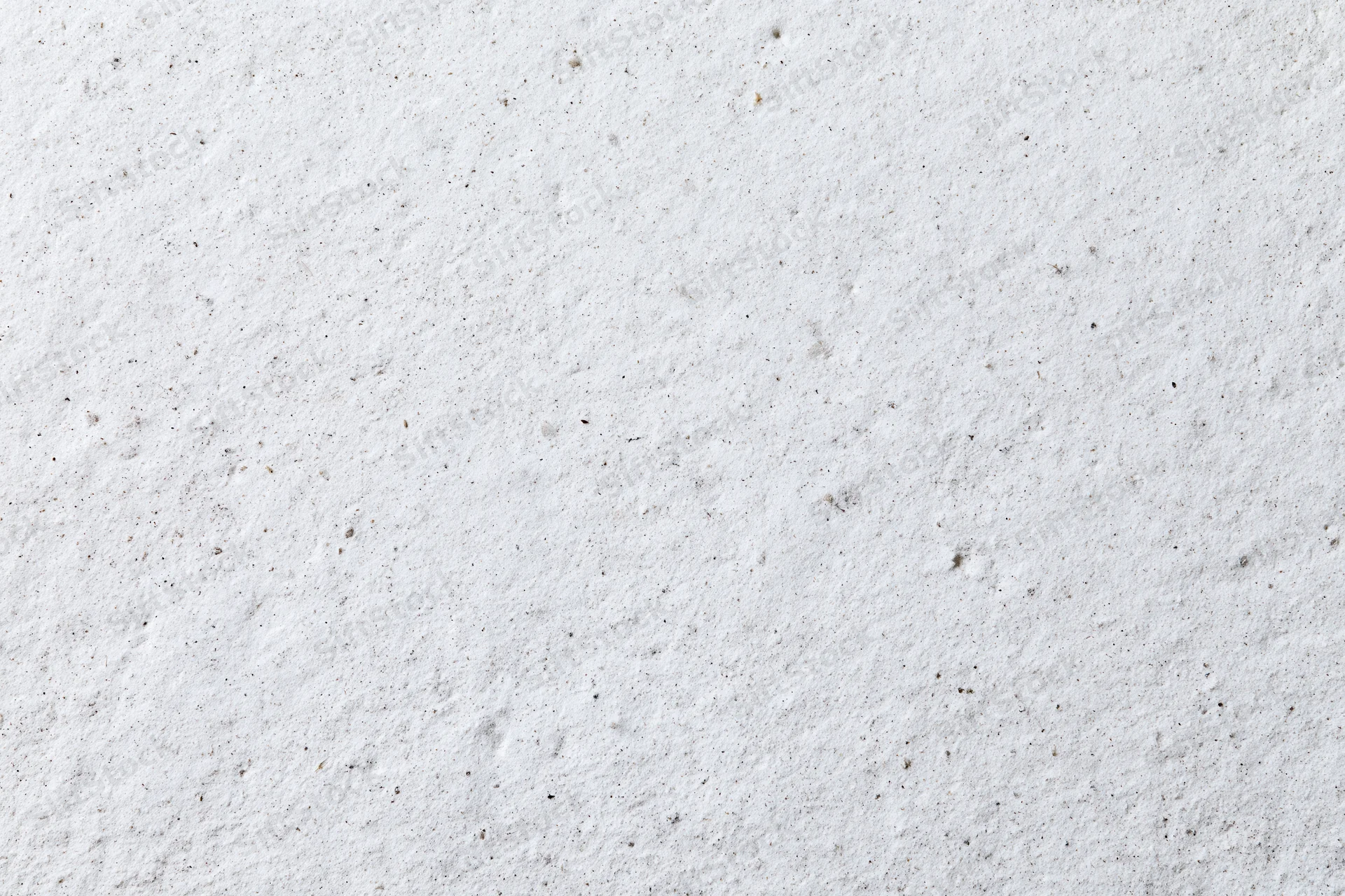 Close-up of a rough white concrete plaster wall surface