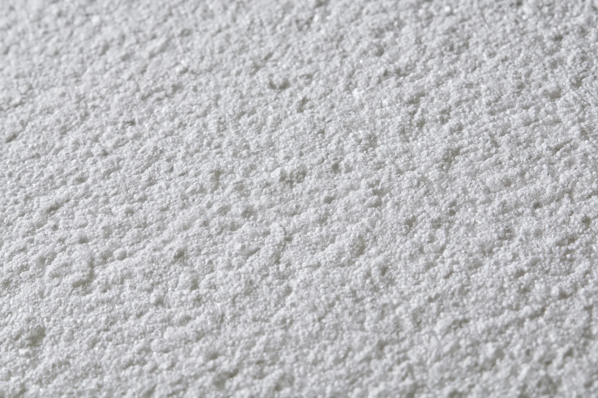Close-up flat lay of a white expanded polystyrene foam sheet surface