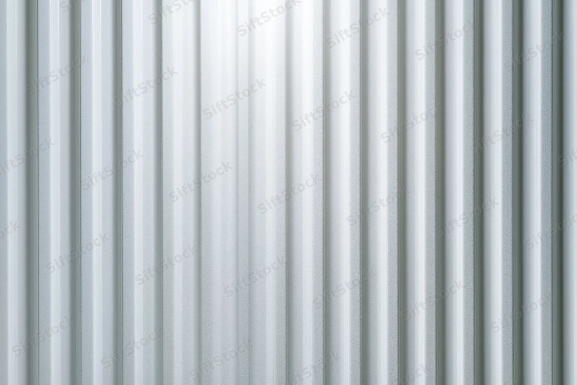 Close-up of a white ribbed panel surface filling the frame