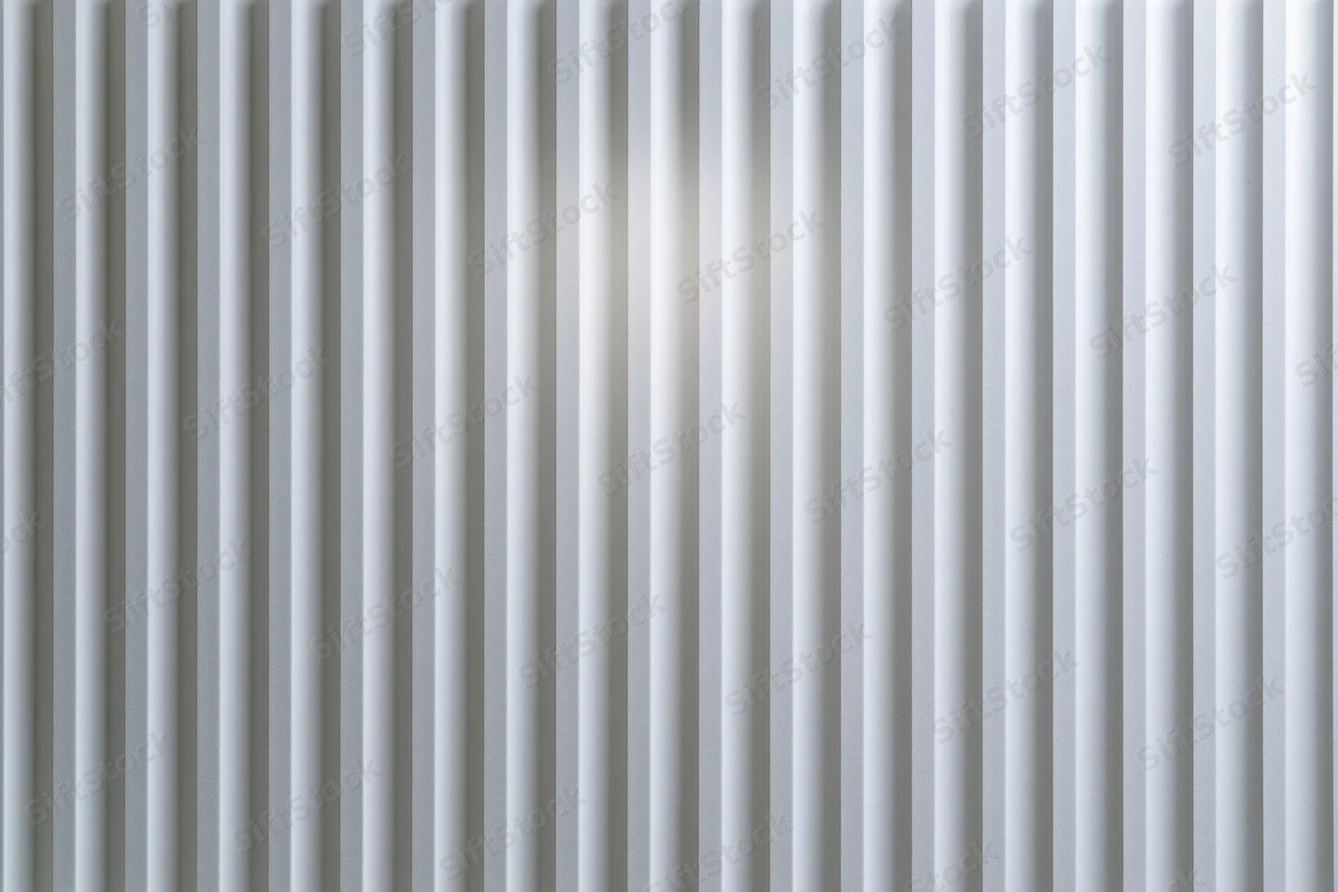 White ribbed panel surface filling the frame with vertical grooves and subtle light reflection