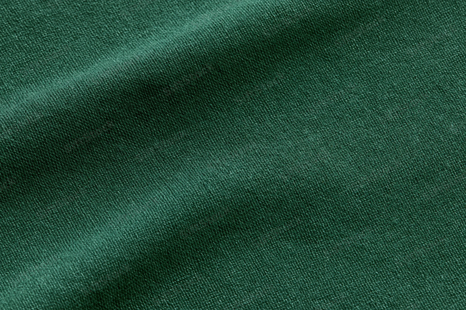 Dark forest green fabric textile filling flat lay close-up