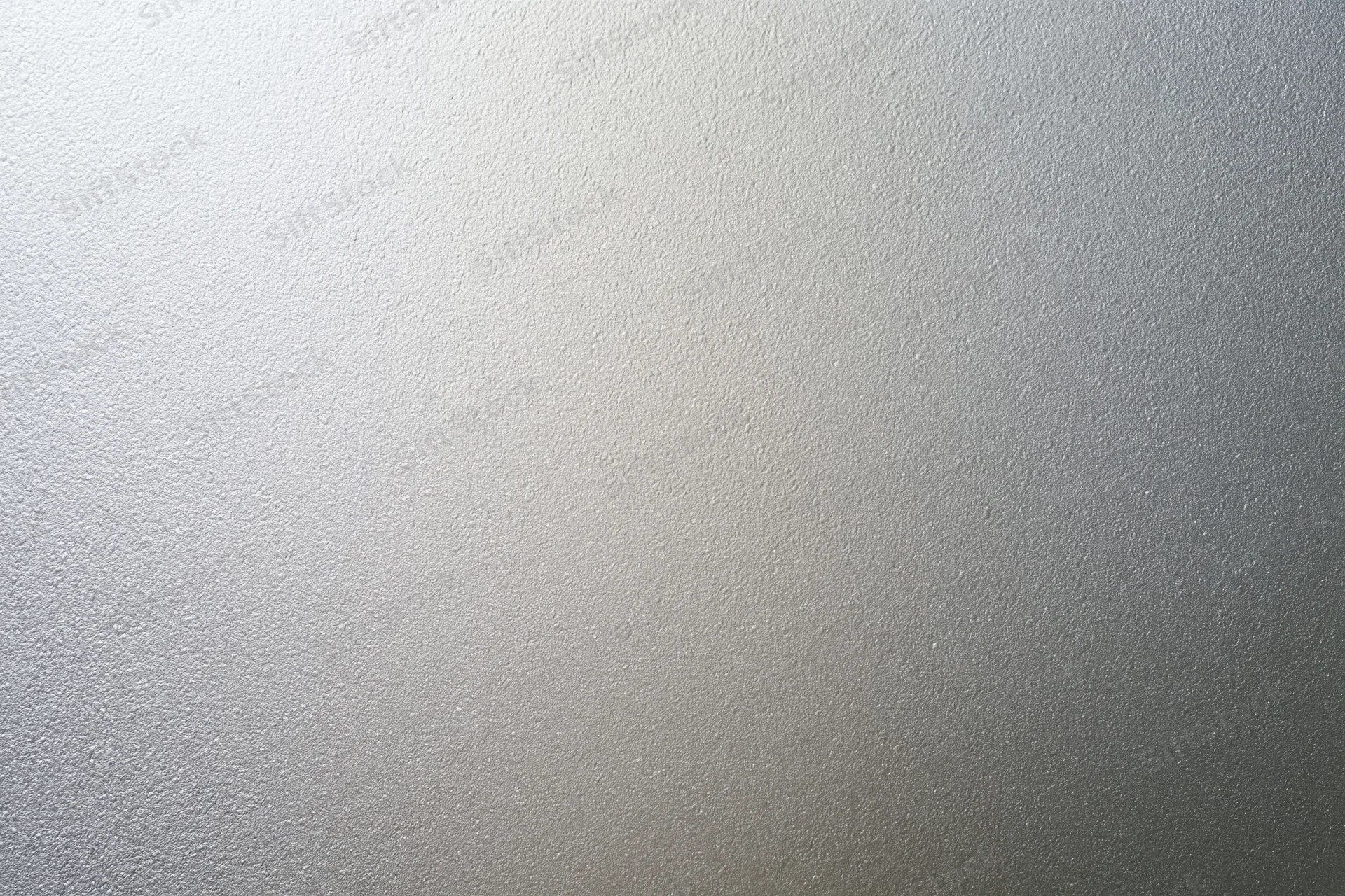 Frosted glass surface with smooth matte texture filling the frame as a neutral background