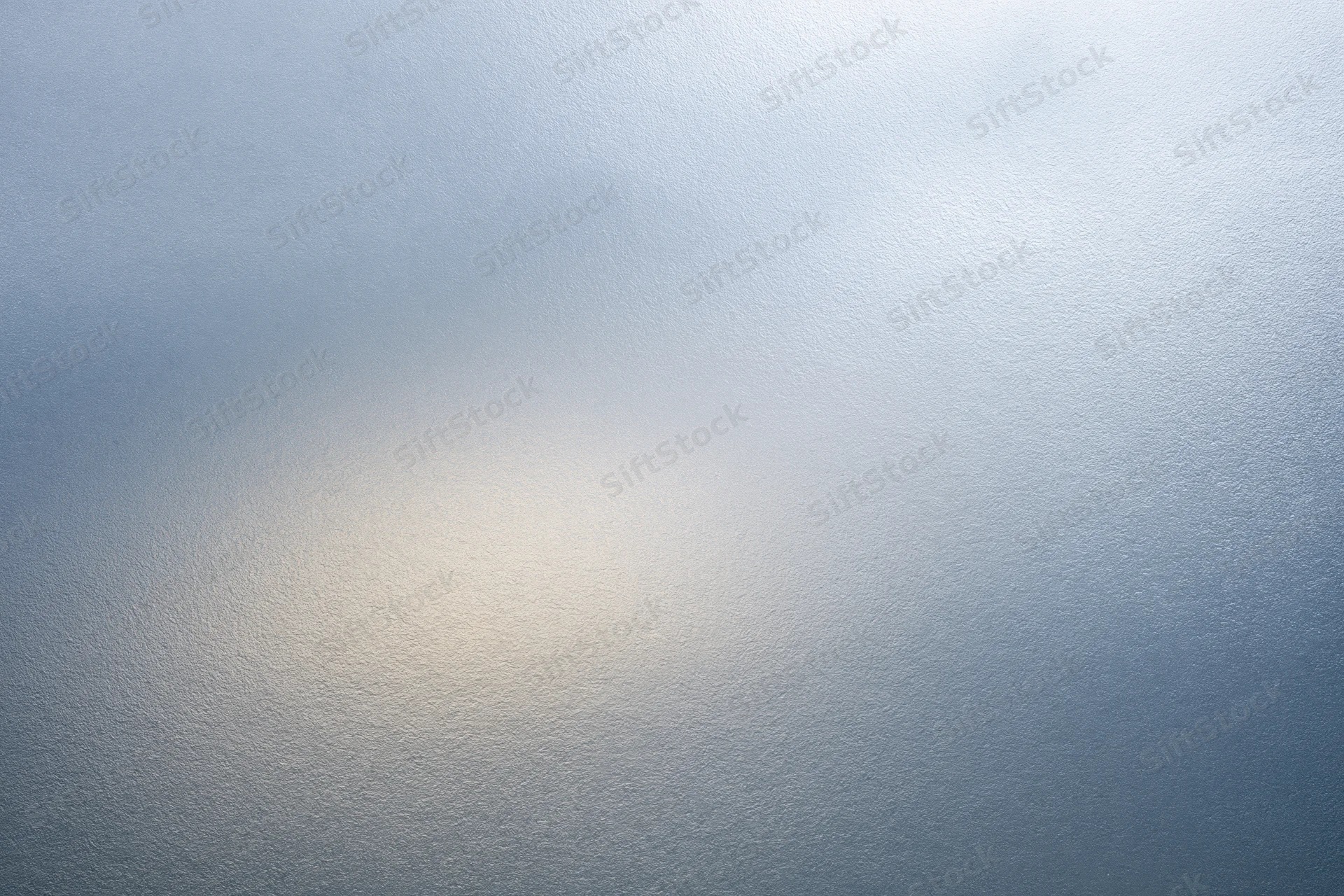 Frosted glass surface with soft light gradient filling the frame