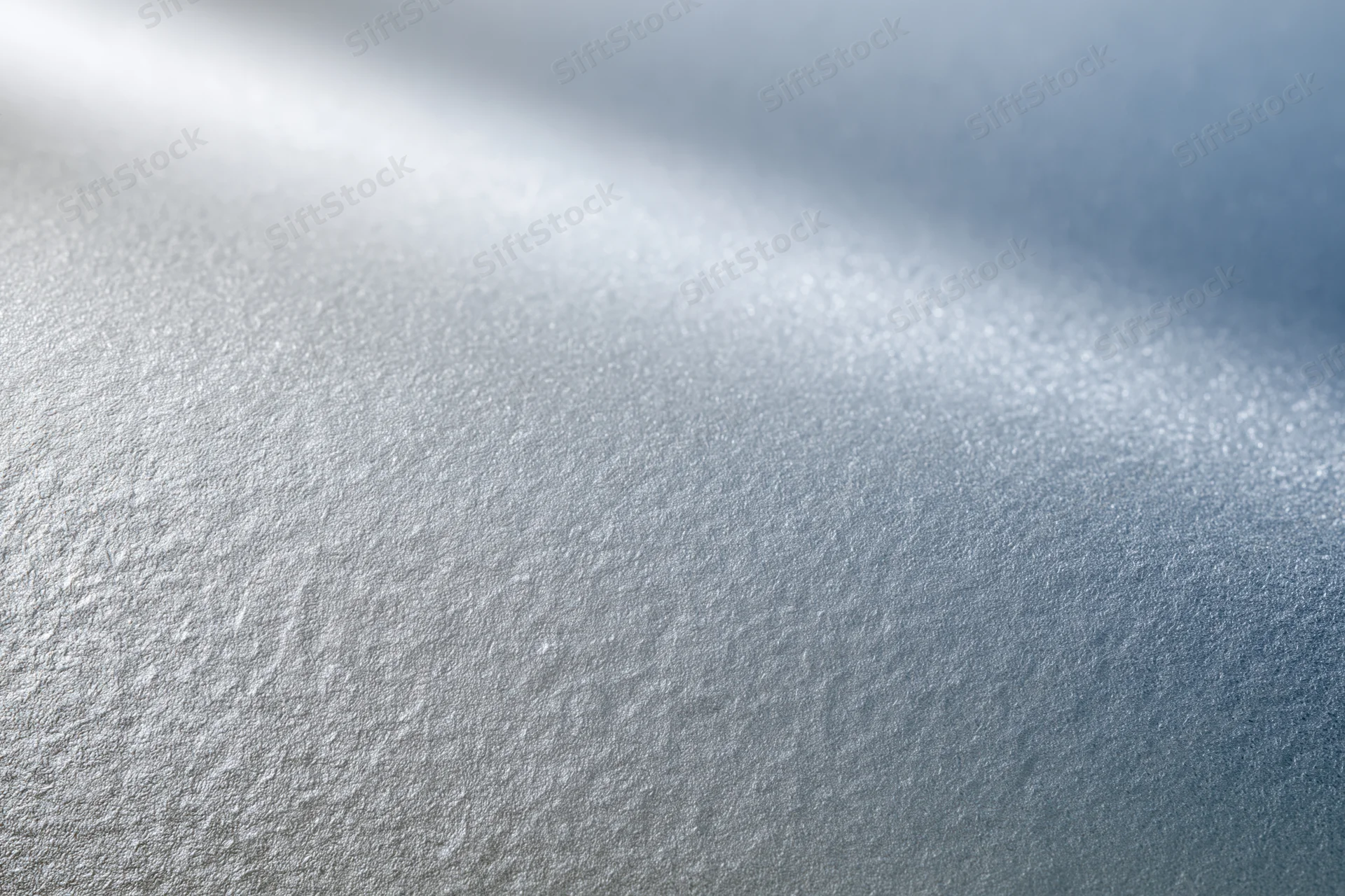 Frosted glass surface in close-up flat lay with soft light and texture details