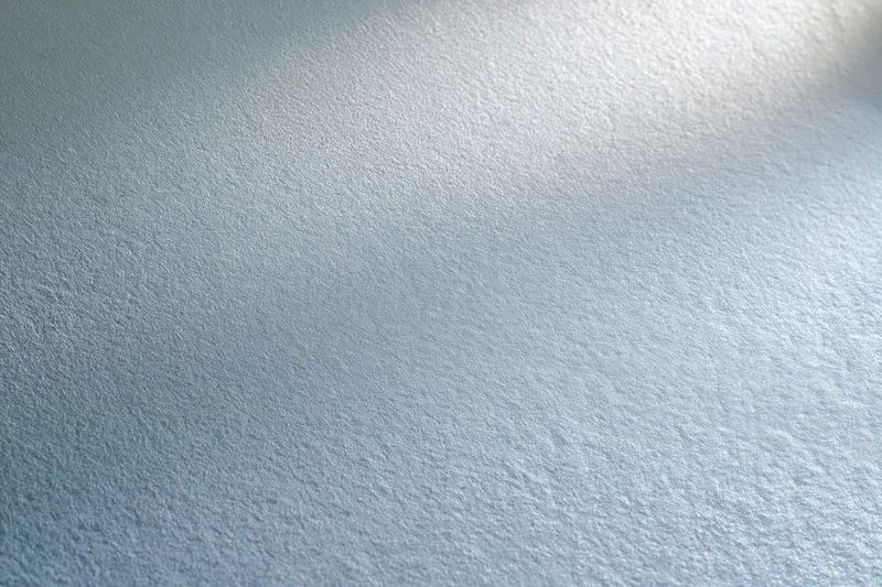Frosted glass surface with smooth texture and light diffusion filling the frame