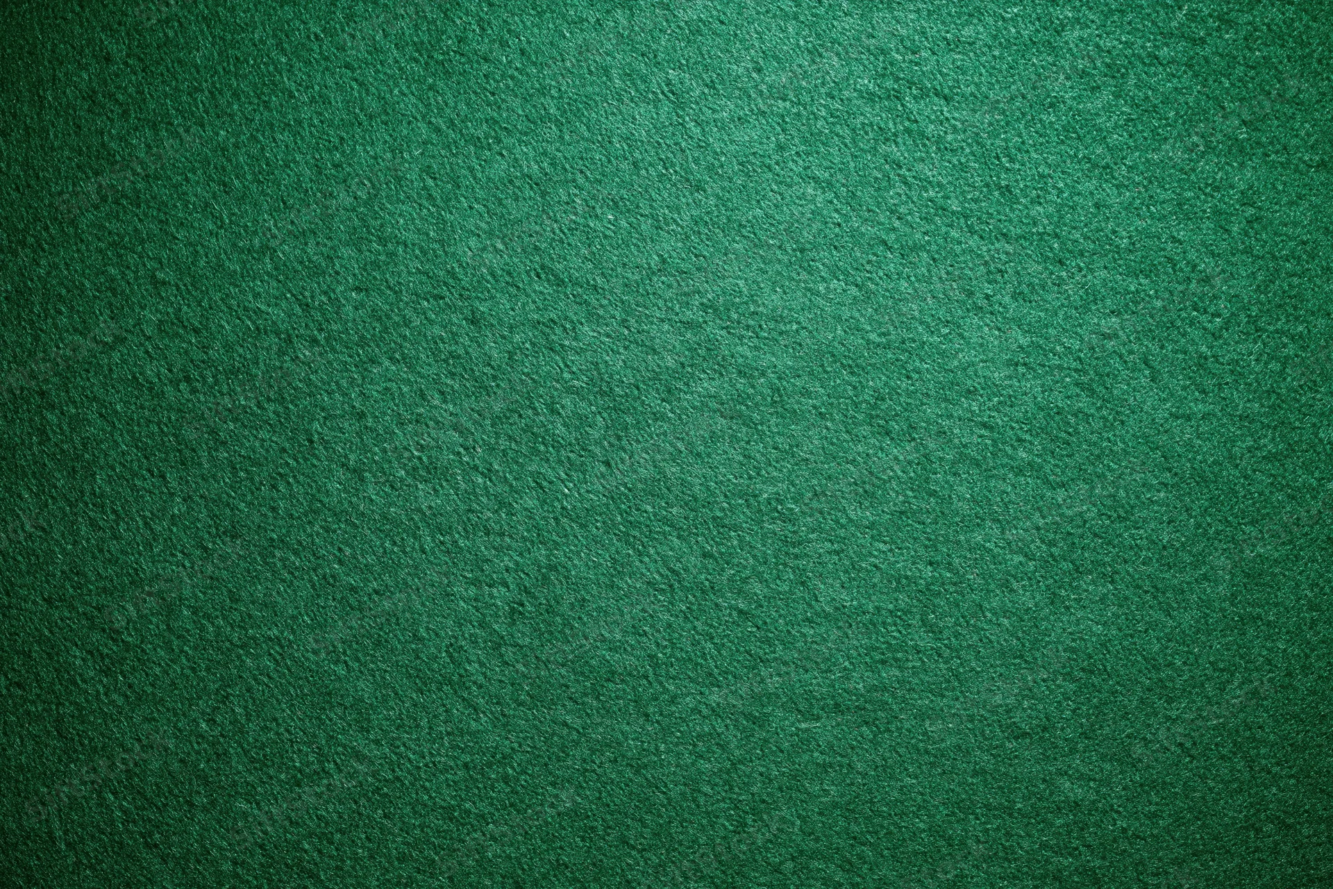 Green casino felt fabric filling the frame in a flat lay close-up view