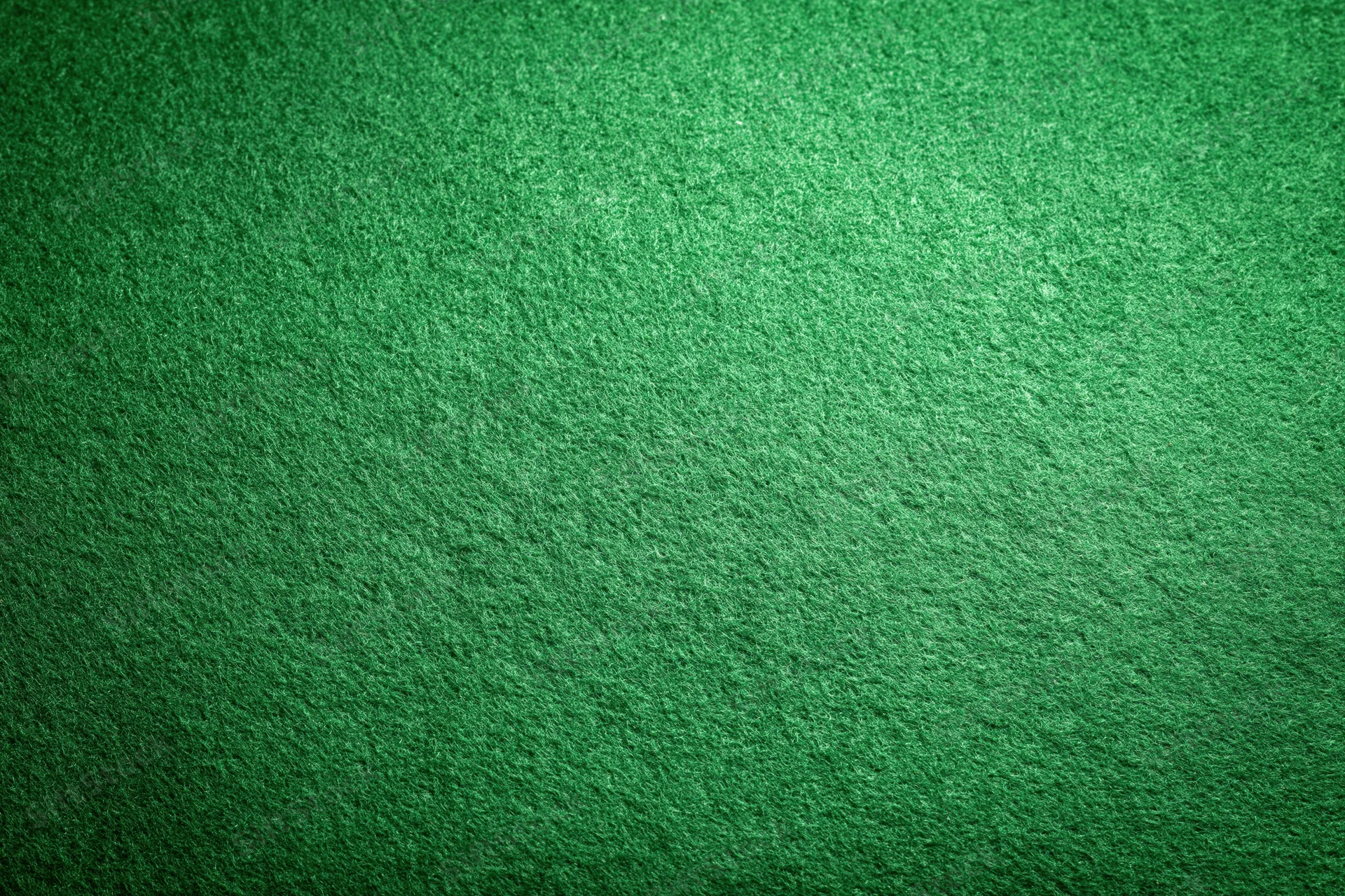 Green felt fabric filling the frame in a flat lay close-up view