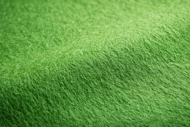 Close-up flat lay of green felt fabric filling the frame