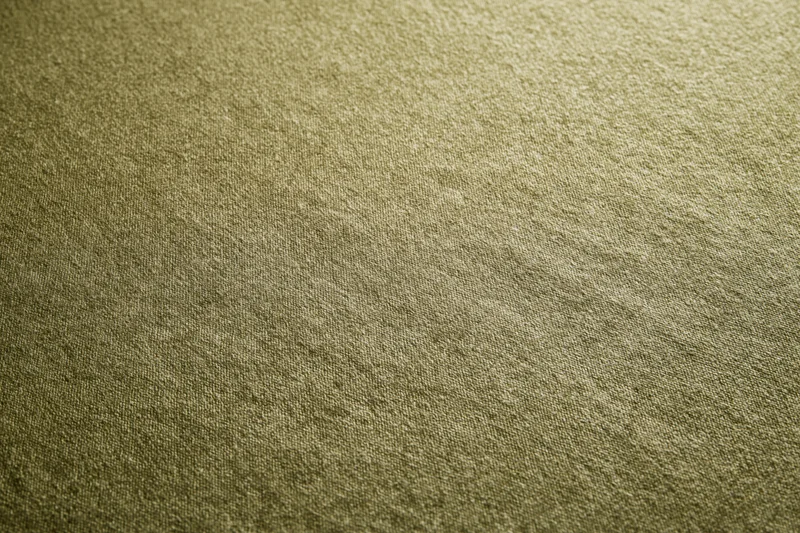 Close-up of medium-green fabric surface filling the frame in a flat lay arrangement