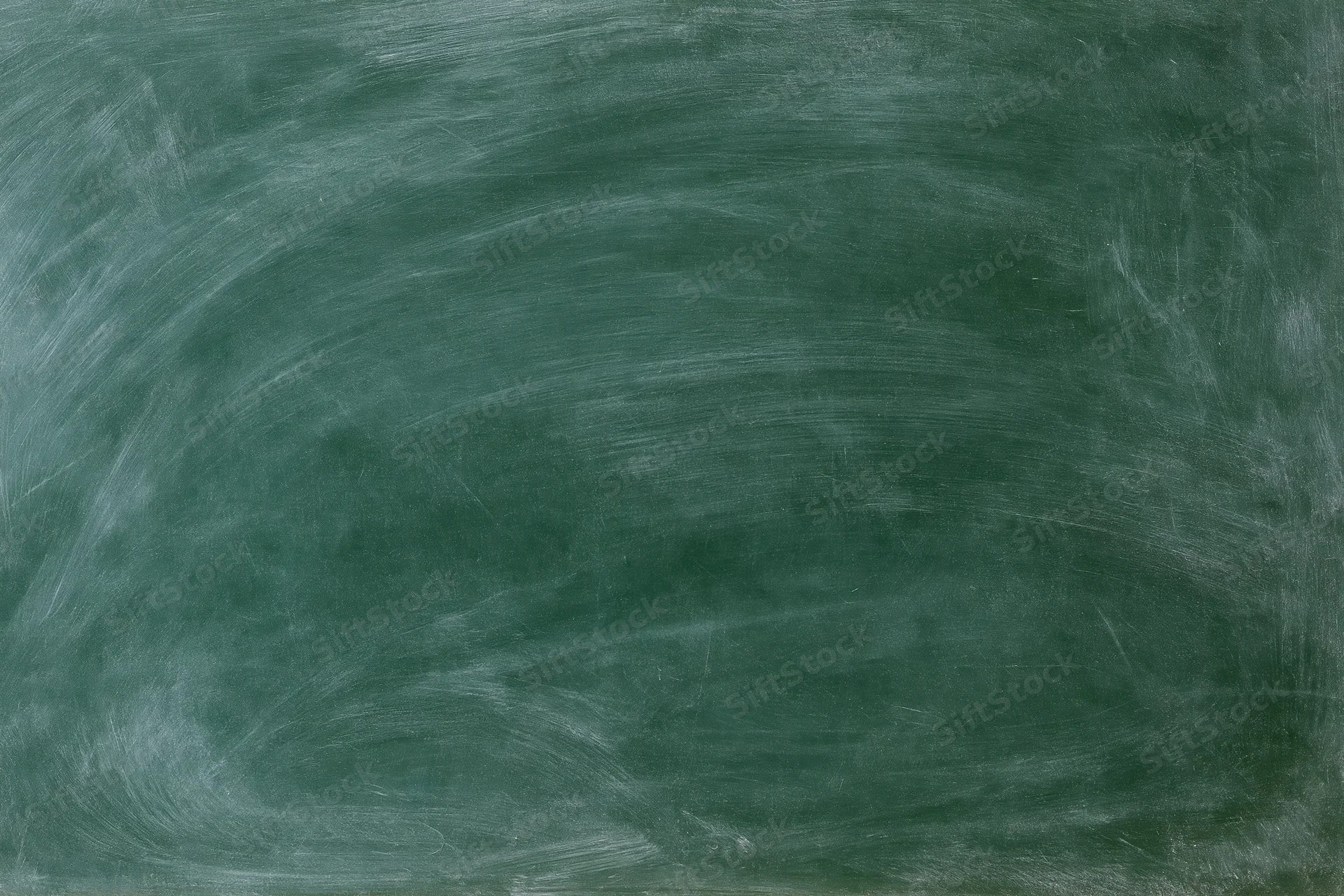 Blank green chalkboard surface with white chalk residue and smudges, no writing visible