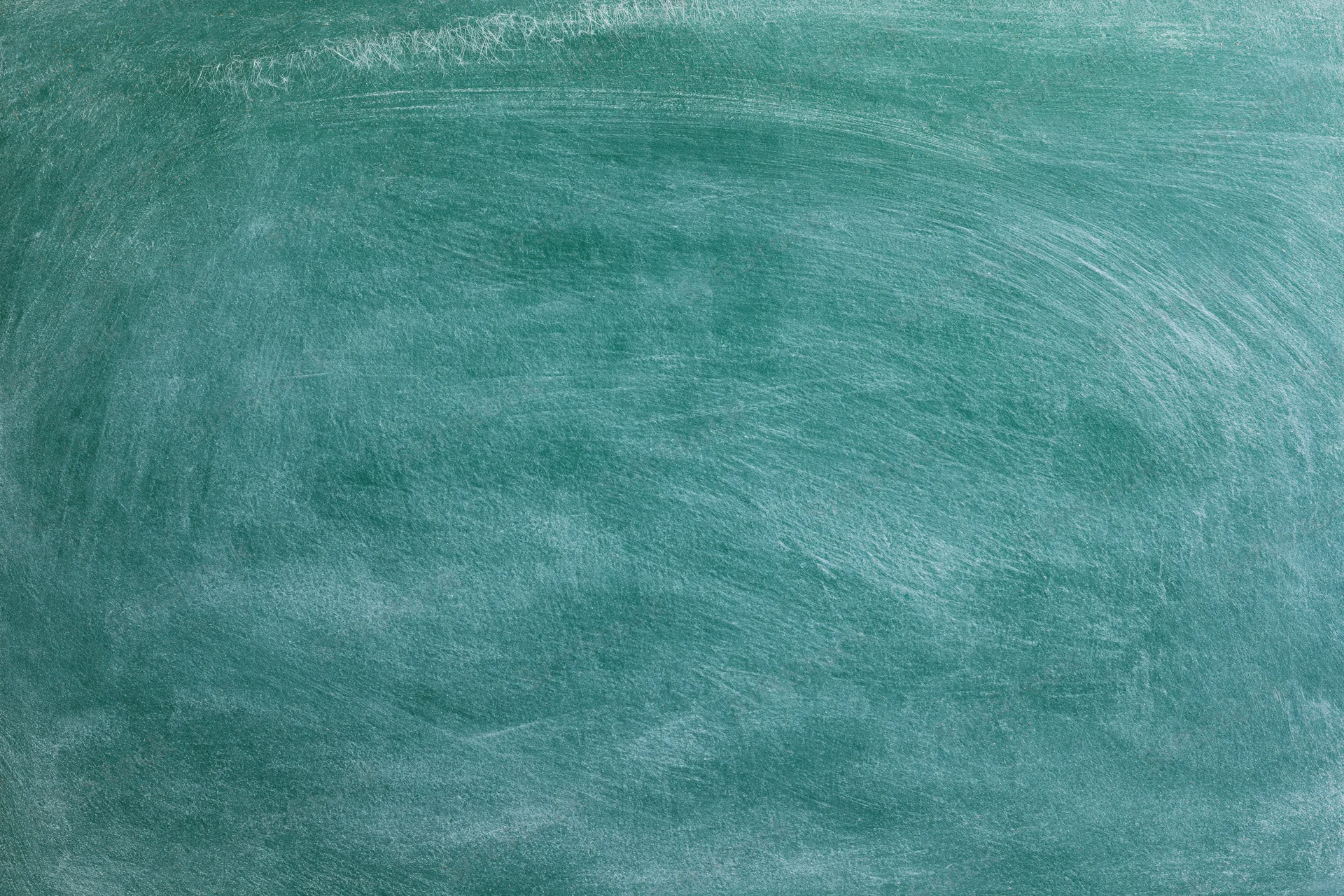 Blank green chalkboard surface with faint white residue and swirl marks, flat close-up view
