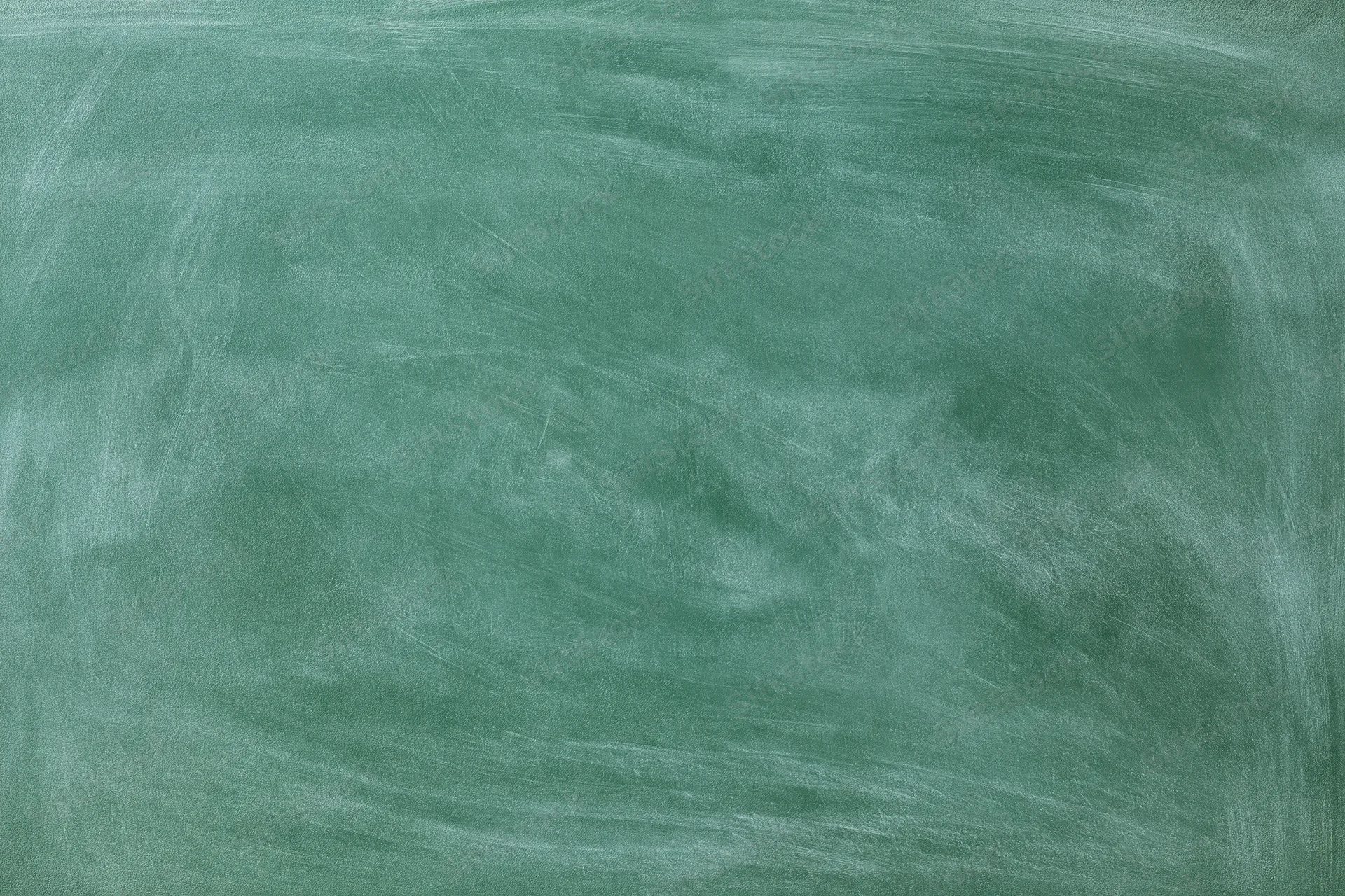 Blank green chalkboard surface with smudged white marks, no writing, flat close-up view