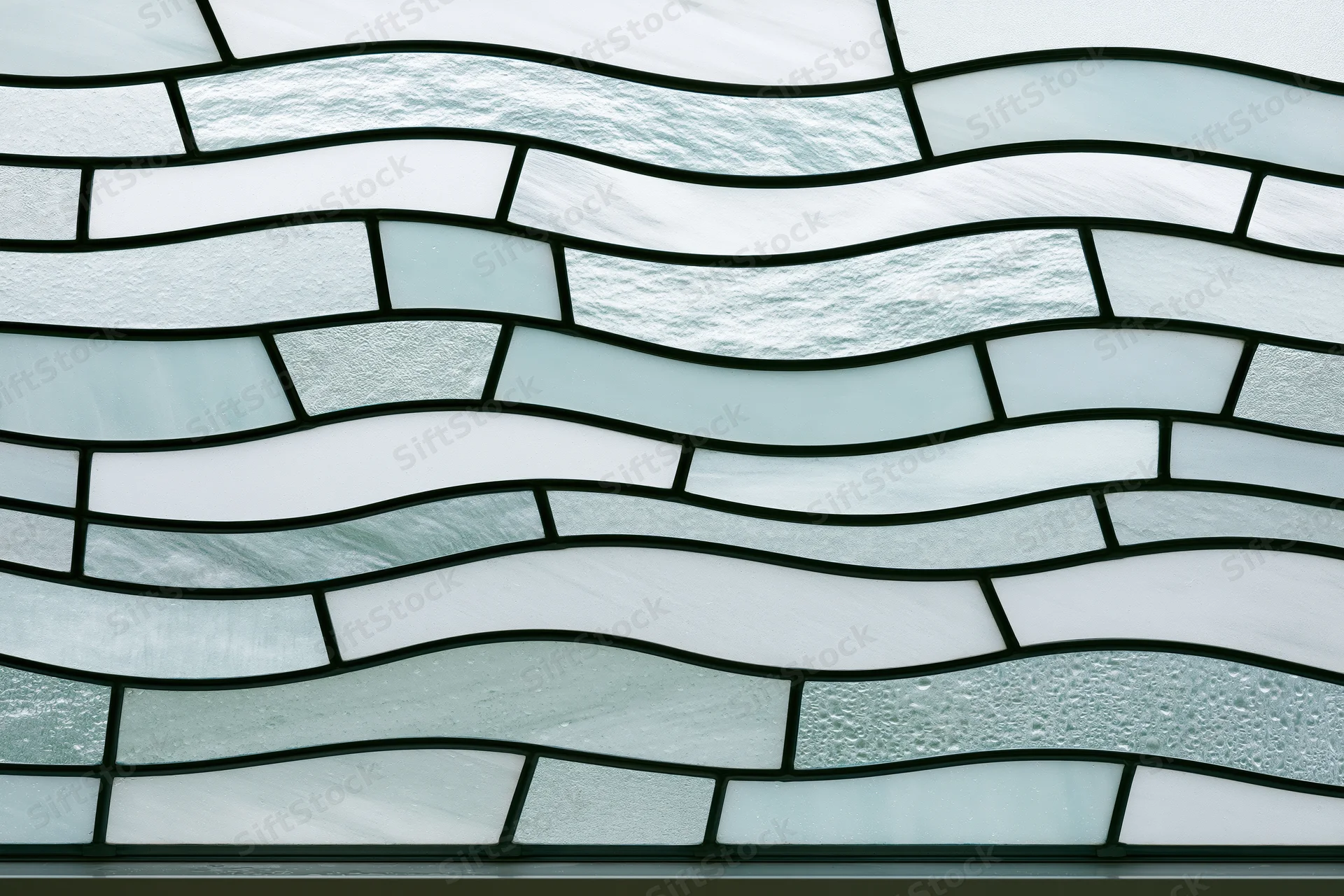 Frosted glass panel with wavy segmented pattern arranged in horizontal rows