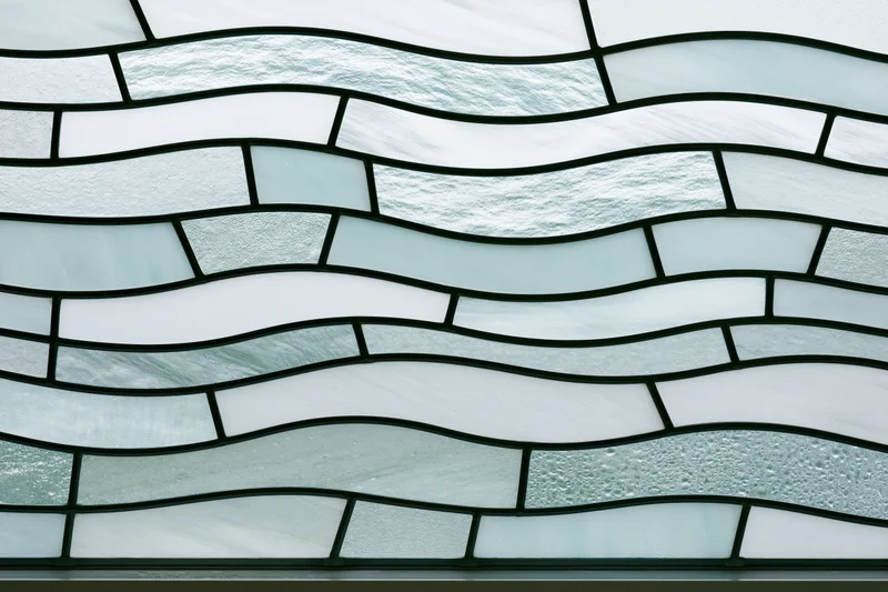 Frosted glass panel with wavy segmented pattern arranged in horizontal rows