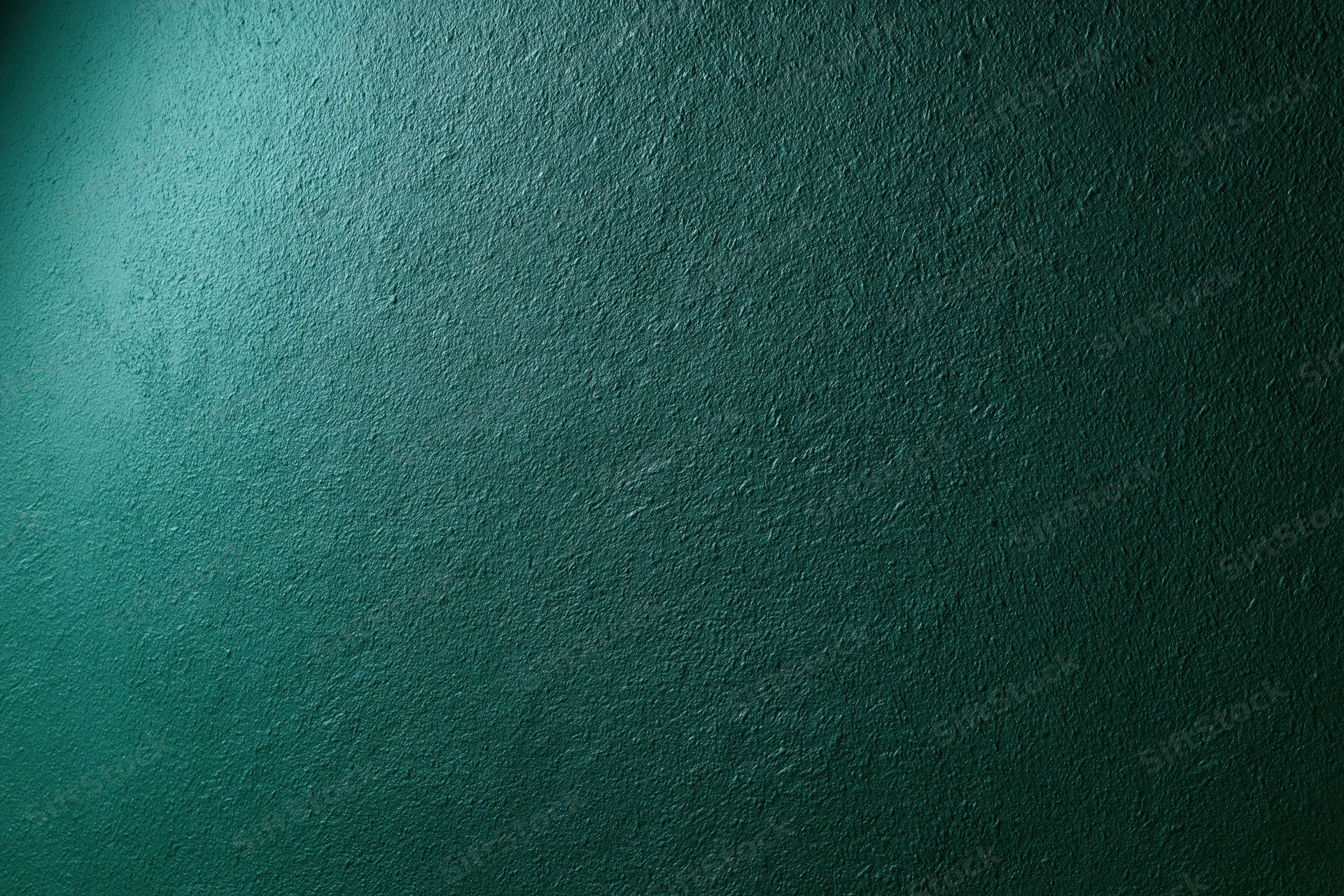 Matte green painted wall surface in close-up flat view
