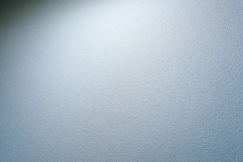 Frosted glass surface with soft light gradient and matte texture as background