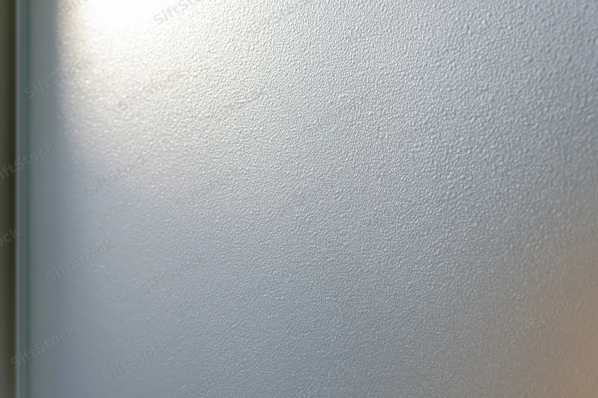 Frosted glass surface with smooth matte texture filling the frame