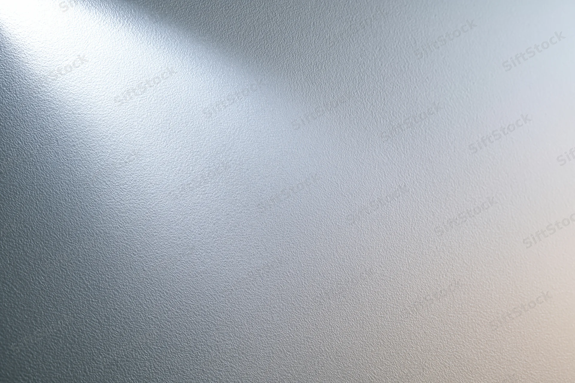 Frosted glass surface with soft light gradient and smooth texture filling the frame