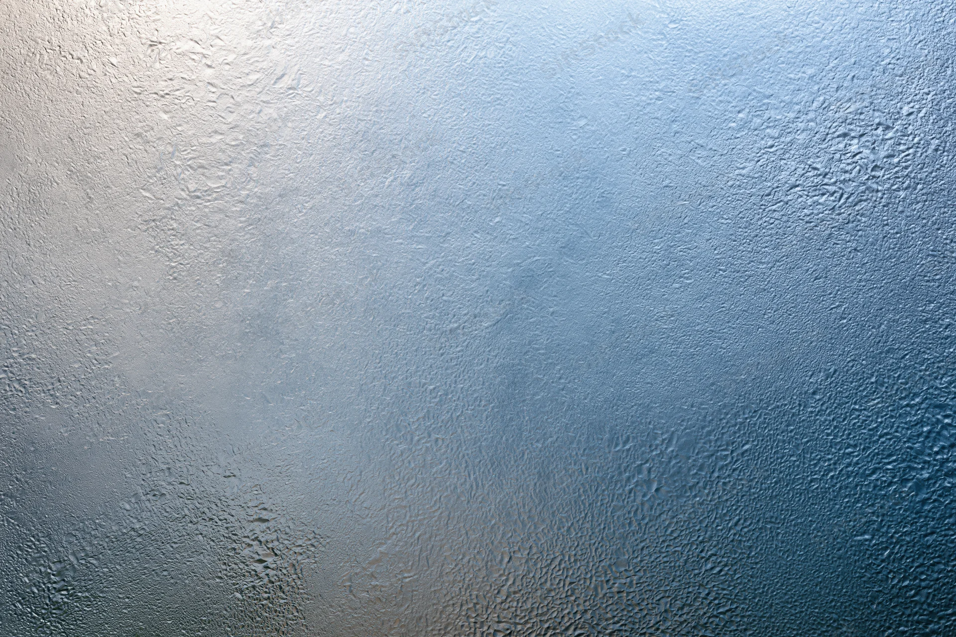 Frosted textured glass surface with blue gradient and light diffusion