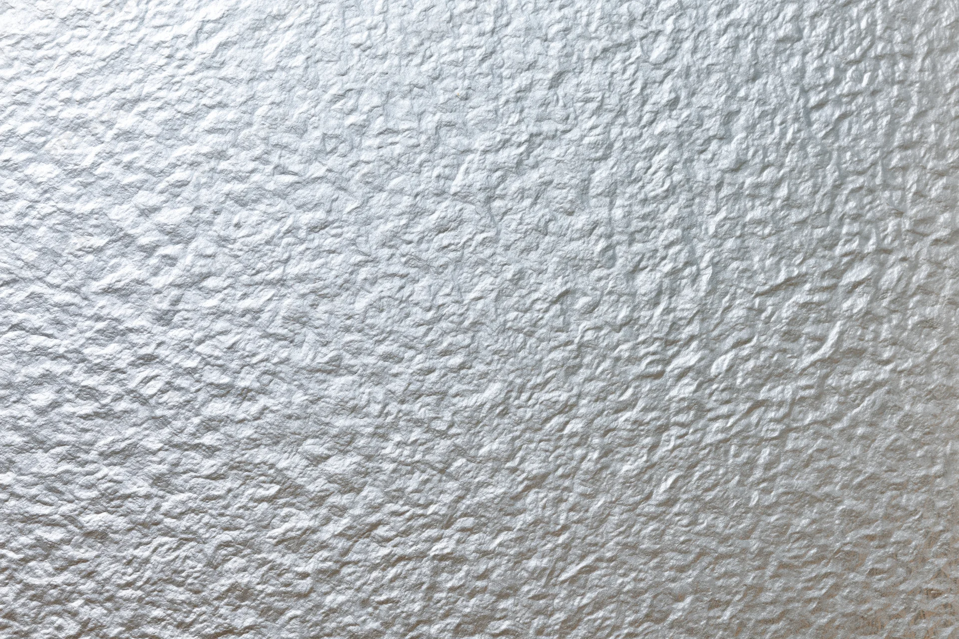 Frosted patterned glass surface filling the frame with textured white translucent finish