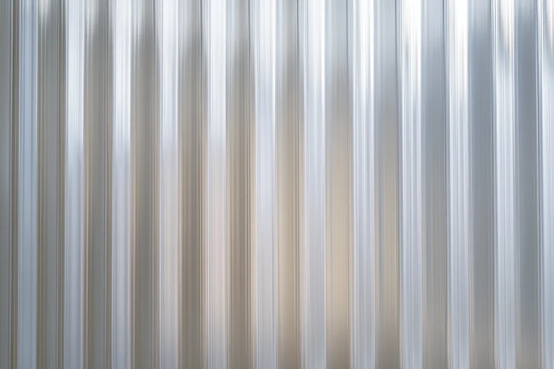 Ribbed translucent polycarbonate sheet with vertical grooves for building cladding