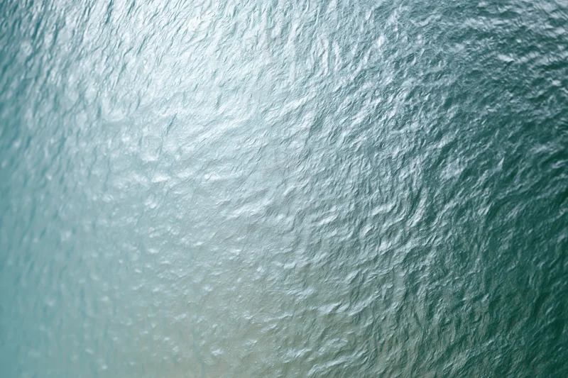 Close-up of frosted glass panel with textured surface and diffused light pattern
