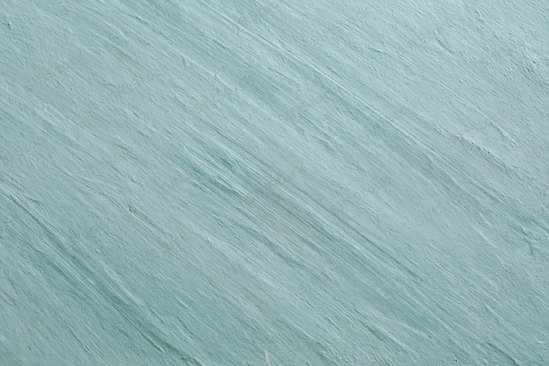 Close-up of a matte painted concrete wall with diagonal brushstroke texture