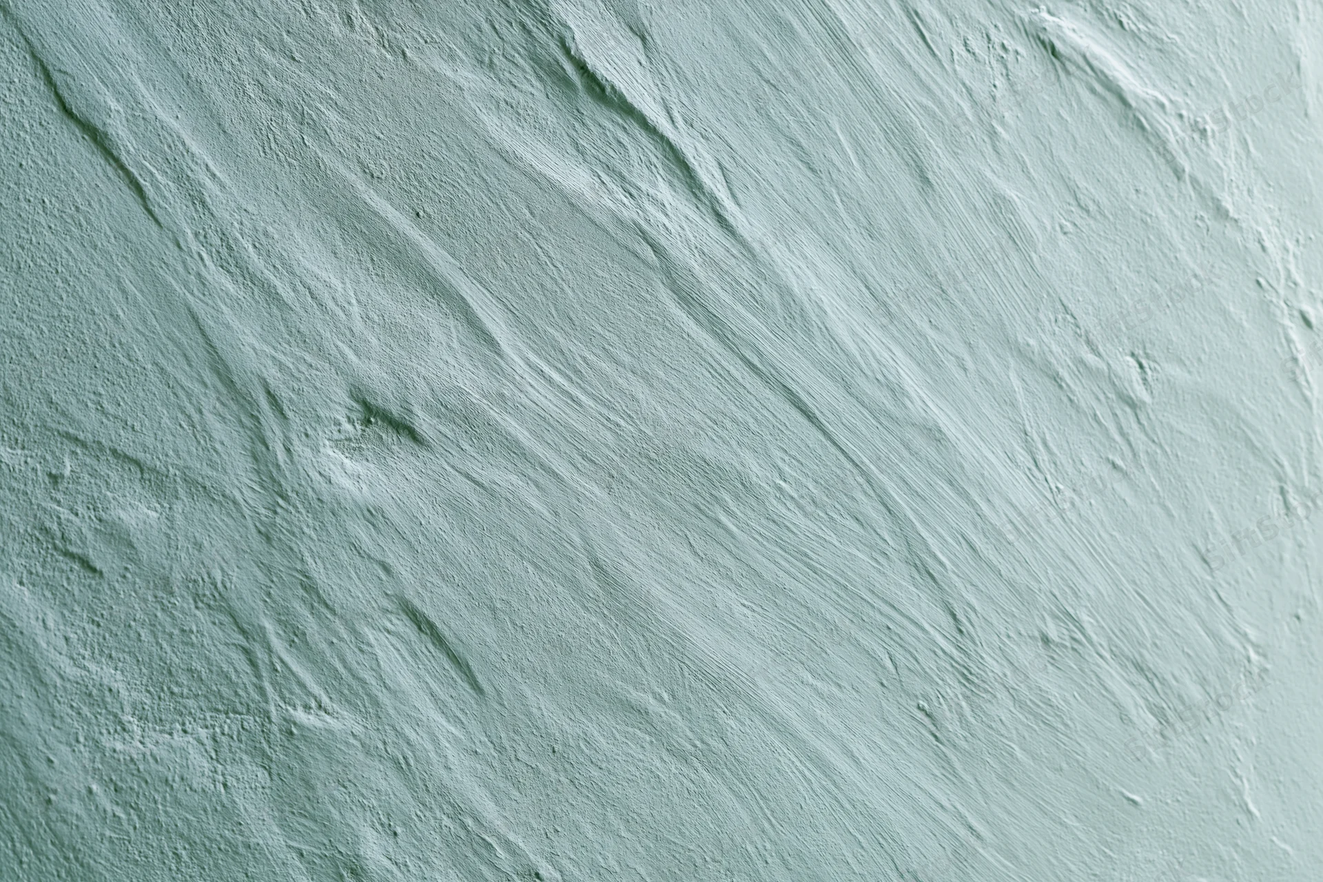 Close-up of matte painted concrete wall surface with visible texture and brushstrokes