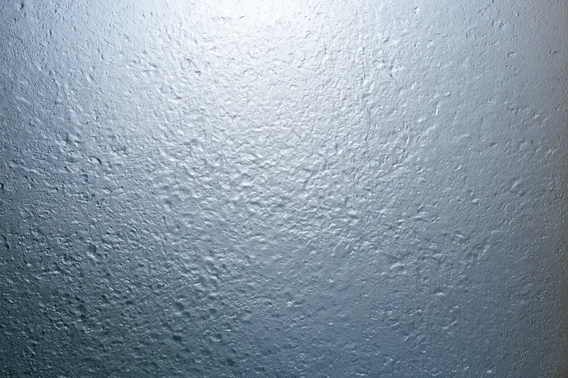 Fogged glass surface covered in fine water droplets from condensation