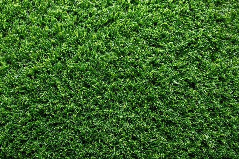 Dense artificial turf surface viewed from overhead in a flat lay arrangement