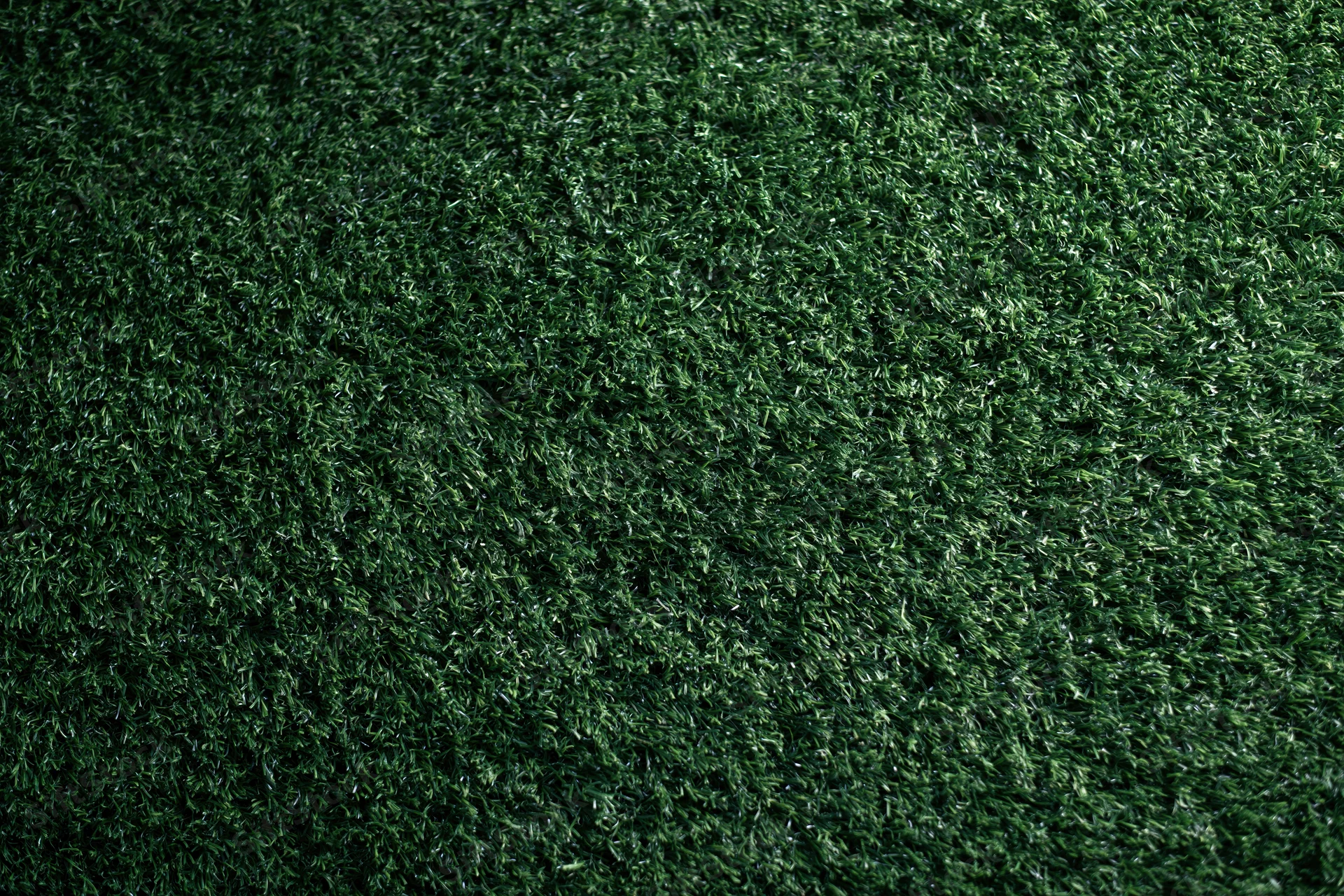 Dense artificial turf grass viewed from above filling the frame