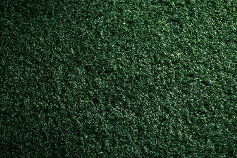 Dense artificial turf grass viewed from above filling the frame