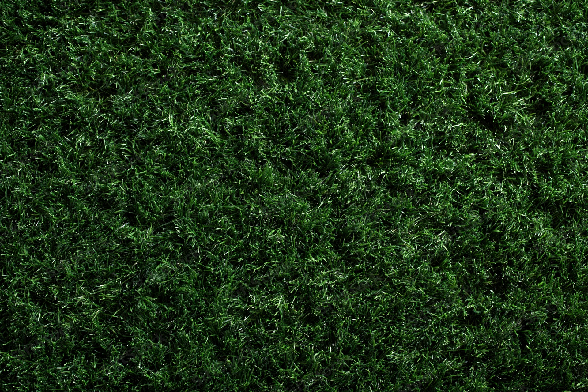 Dense artificial turf grass viewed from above filling the frame