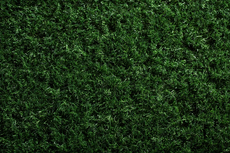 Dense artificial turf grass viewed from above filling the frame