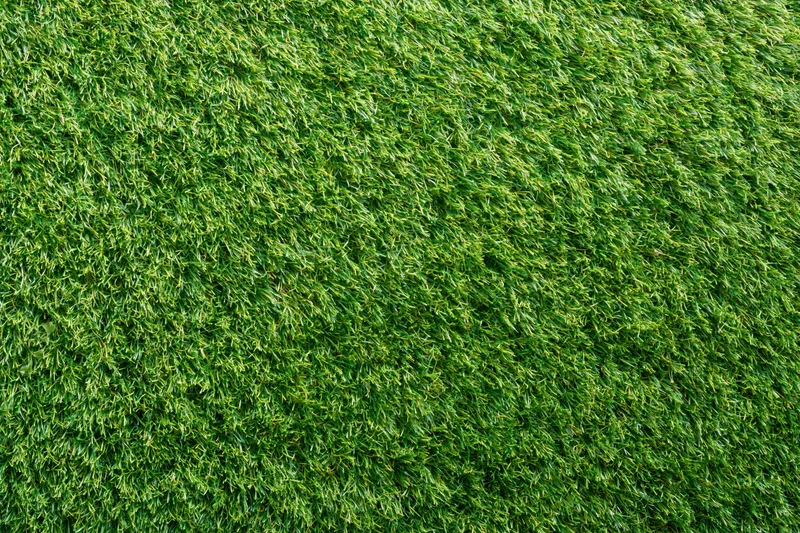 Dense short-cut artificial turf viewed from overhead, forming a uniform green surface