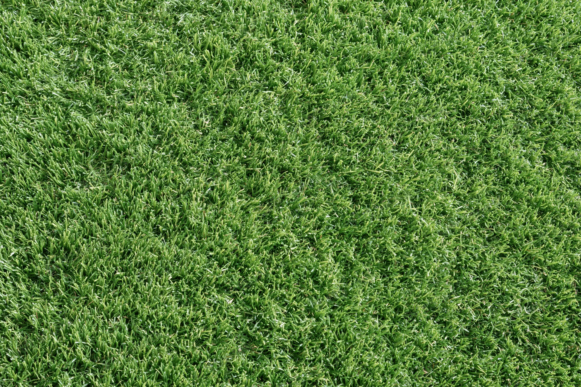Closely mown artificial turf surface filling the frame