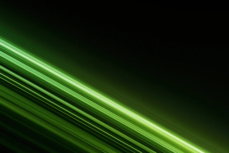 Diagonal streaks of bright green light cutting across a dark background